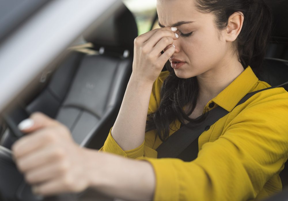 woman-driving-having-headache
